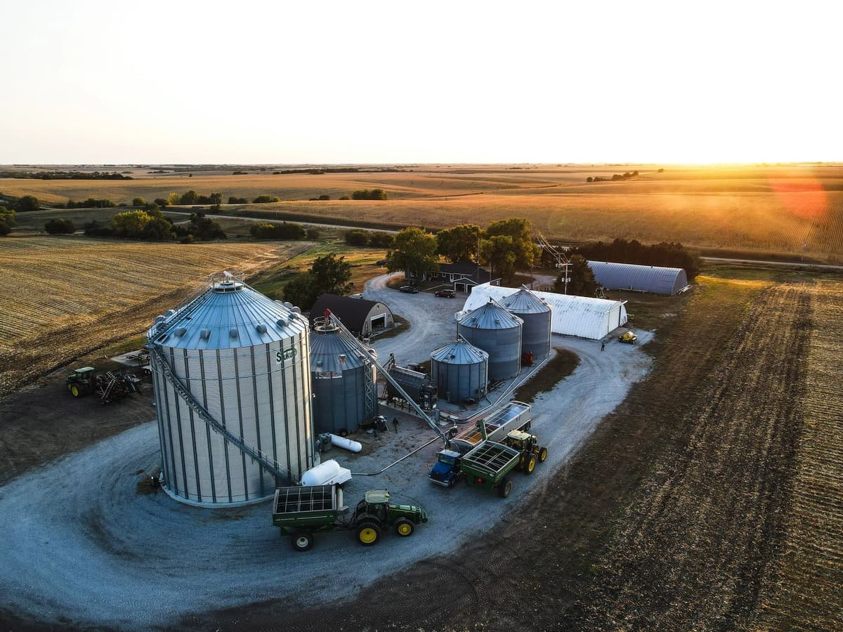 Aerial view of a farm operation at sunset